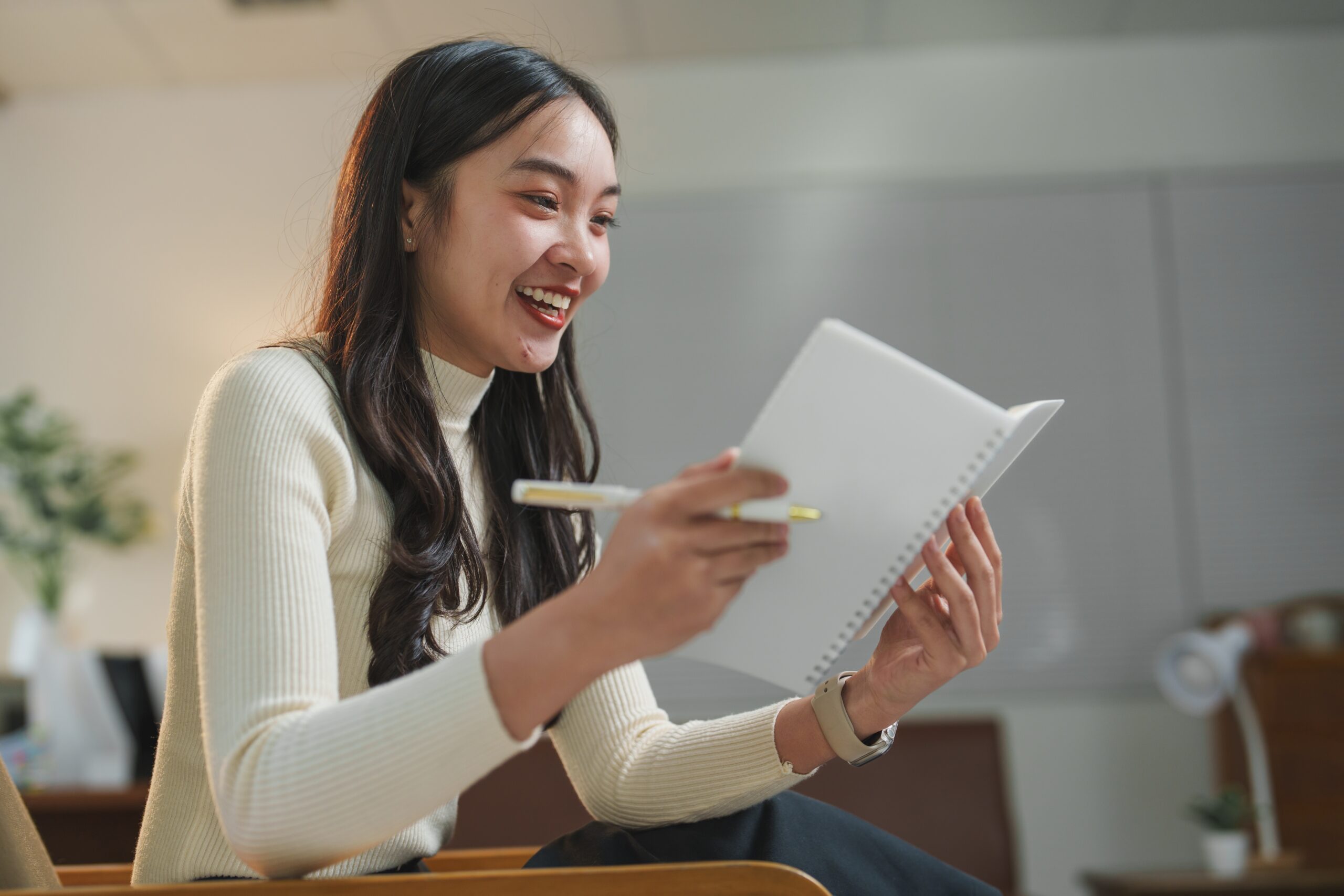 A young salesperson studying to have a strong product knowledge.